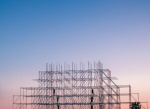 A silhouetted structure against a colorful sunset, showcasing industrial scaffolding in Sochi, Russia.